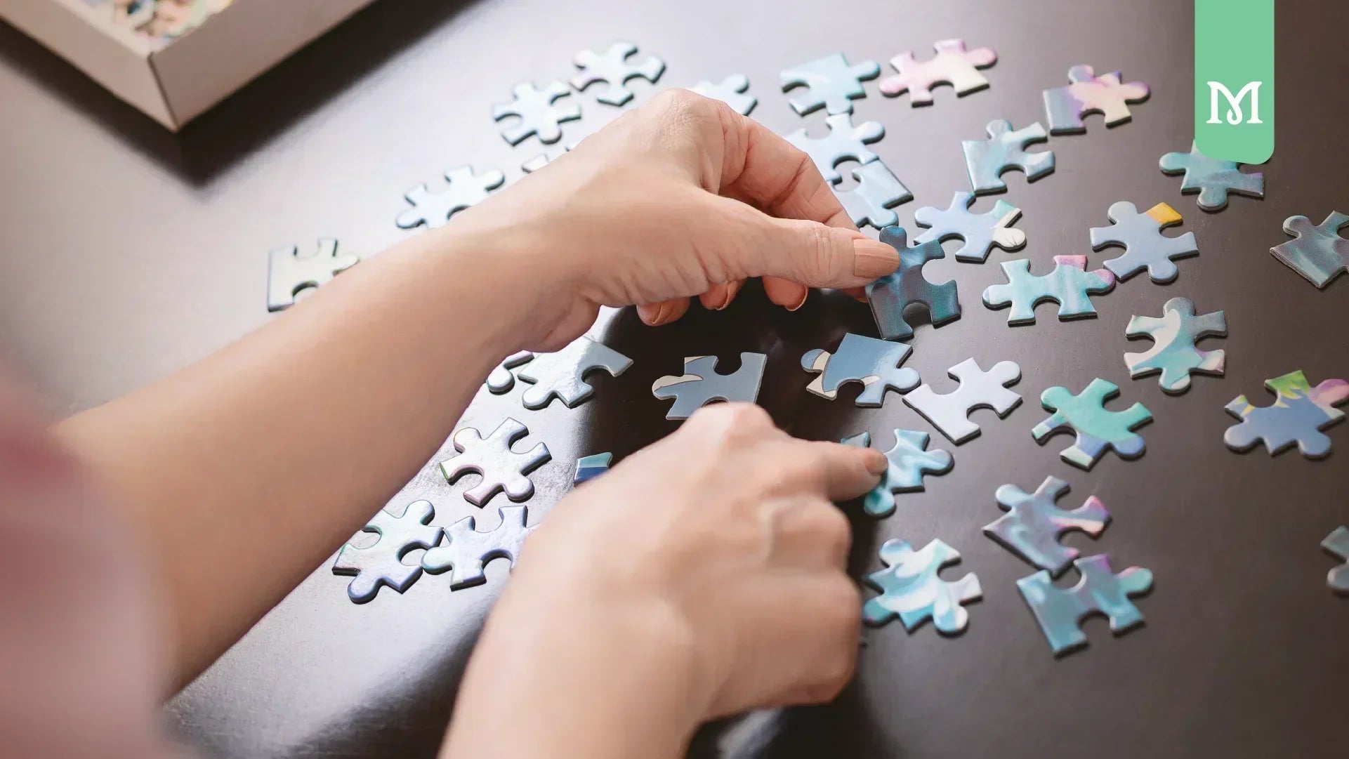 kid hands making a puzzle