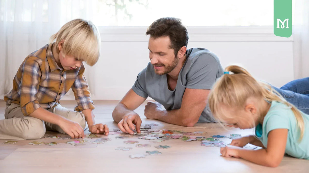 family solving a puzzle on a living room