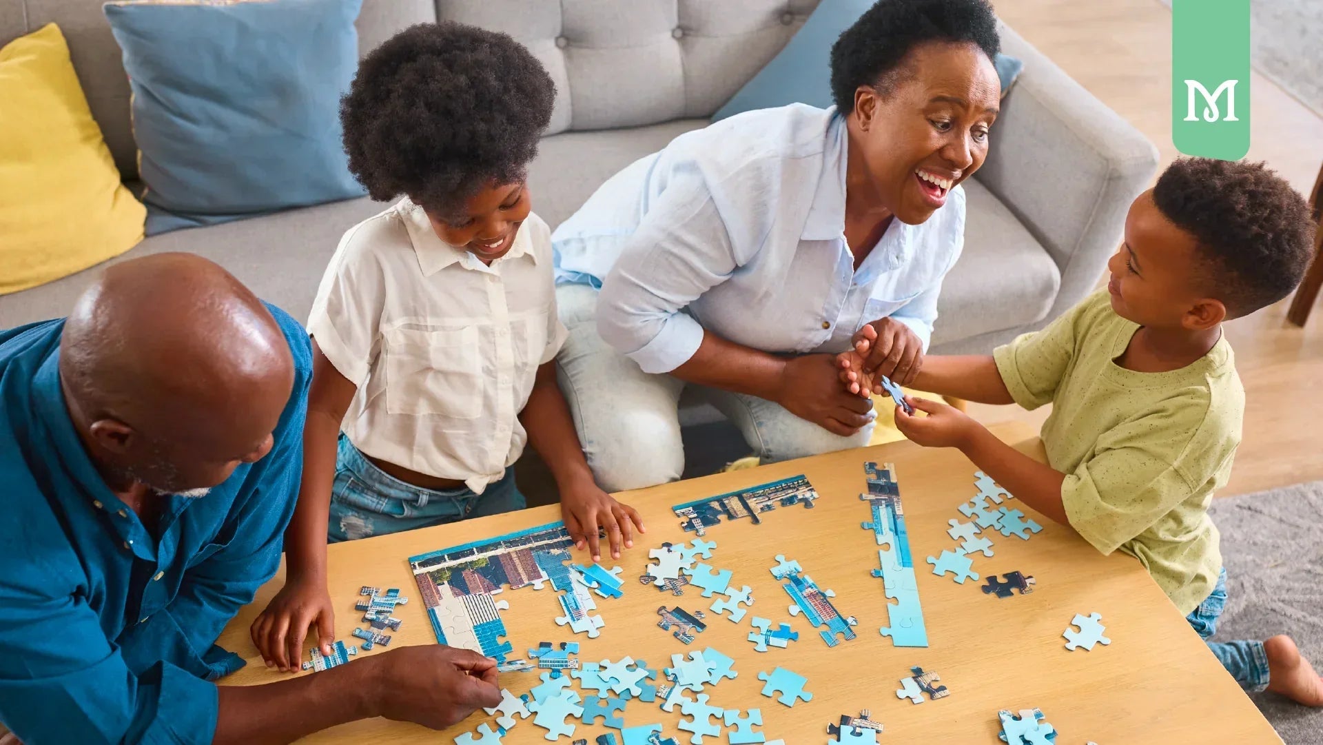 family making a puzzle together on a table