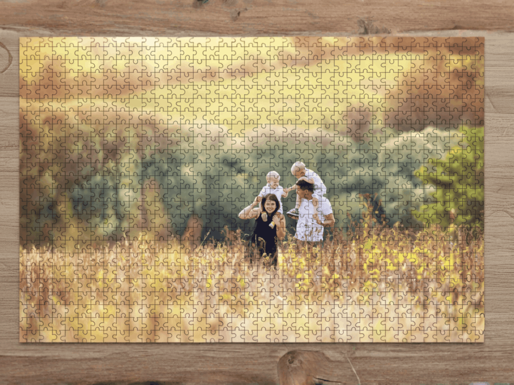Jigsaw puzzle with a family in a field on a wooden surface
