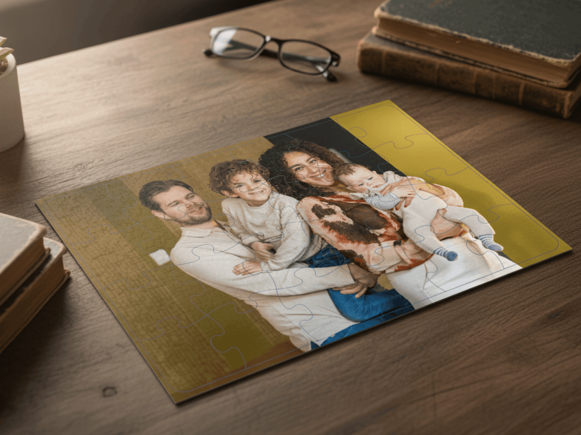 Family photo on a wooden table with books and glasses